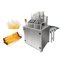Machine de remplissage entièrement automatique pour liquides (miel, sauces), avec découpe de pailles et emballage, et remplissage quantitatif automatique