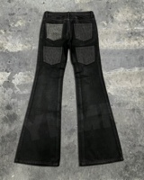 Jean évasé slim fit pour homme, style motard, en denim délavé à l'acide, avec poches léopard personnalisées, effet vieilli, clouté et à rivets