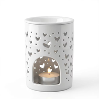 Brûleur d'huiles essentielles en céramique blanche en gros avec un design creux en forme de cœur pour diffuseur de parfum d'intérieur