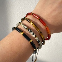 Bracelet extensible en perles tubulaires de pierres précieuses naturelles, avec disque d'hématite dorée, cornaline rouge, œil de tigre, jaspe dalmatien et obsidienne