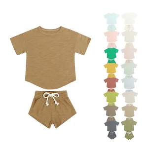 2024 ऑर्गेनिक बेबी कपड़े ठोस रंग साधारण होम आउटडोर स्पोर्ट्स किड्स सूट छोटी आस्तीन वाले बेबी कपड़े सेट