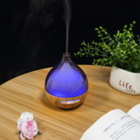 Diffuseur d'arômes ultrasonique transparent avec réservoir d'eau, humidificateur à brume froide et lumière LED à changement de couleur pour chambre à coucher et usage domestique