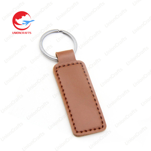 Venta al por mayor de llavero de cuero con logotipo personalizado, llavero con abalorio con estampado de coche, llavero con sublimación grabado en blanco, llavero redondo de cuero auténtico