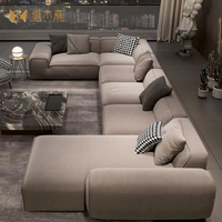 Ensemble de canapés modulaires en forme de L de style italien minimaliste avec cadre en bois, rembourrage en éponge et revêtement en tissu givré pour grand appartement
