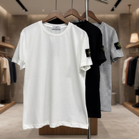 T-shirt en coton pour homme, coupe classique, col rond, manches courtes, couleur unie, style décontracté, logo sur la manche gauche