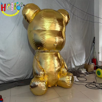 Sculpture géante gonflable en or métallique d'un ours assis, accessoire décoratif pour centre commercial de luxe
