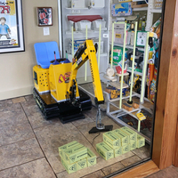 Machine de jeu d'intérieur à pièces pour enfants avec mécanisme de levage magnétique Construction en fibre de verre et métal Garantie 1 an