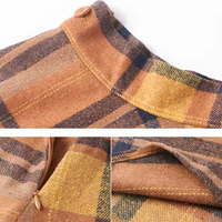 Ensemble deux-pièces en tricot côtelé à manches longues, avec jupe à carreaux en diamant, style européen hivernal et mode.