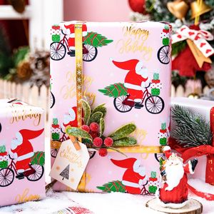 Papel de regalo navideño rosa con diseño divertido de Papá Noel en bicicleta, patrón reversible a cuadros, 17 pulgadas x 32.8 pies, para manualidades navideñas - Product Image 2