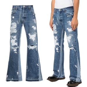 Vaqueros de mezclilla azules de moda para hombre, corte bootcut, desgastados, con parches y salpicaduras de pintura, rasgados y acampanados - Product Image 1