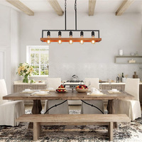 Luminaire suspendu de style industriel américain pour restaurant, en fer noir et bois massif, idéal pour bar et café.
