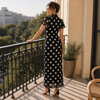 Robe longue noire à pois avec nœud et bordure en dentelle pour la vente en gros