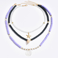 Collier ras du cou multi-rangs 3 brins en perles d'argile noires et violettes, coquillages, étoiles de mer et perles, bijoux fantaisie pour femme, pendentif tendance