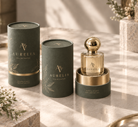 Boîtes d'emballage cylindriques personnalisées pour huiles essentielles et parfums avec gaufrage, doublure en éponge en papier artistique et fermeture magnétique dorée