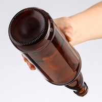 Botella de vidrio de cerveza transparente marrón ámbar de alta calidad de 330ml con tapa