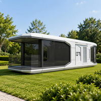 Bureau modulaire en forme de capsule longue avec mur-rideau en verre intégré au conteneur, balustrade de terrasse intégrée, unité de cabine panoramique