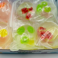 Balle anti-stress sensorielle translucide en forme de tranche de fruit à l'huile de coco, jouet à presser 3+