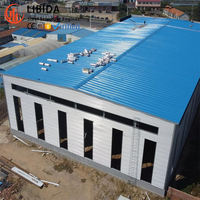 Structure en acier multifonctionnelle au design moderne personnalisé, prix de gros, durable, idéale pour l'utilisation en entrepôt et atelier