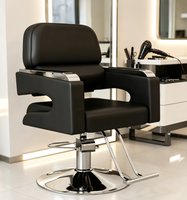Chaise de salon professionnelle pour coiffeur, en cuir PU noir de luxe, avec repose-pieds en métal et accoudoirs réglables hydrauliquement.