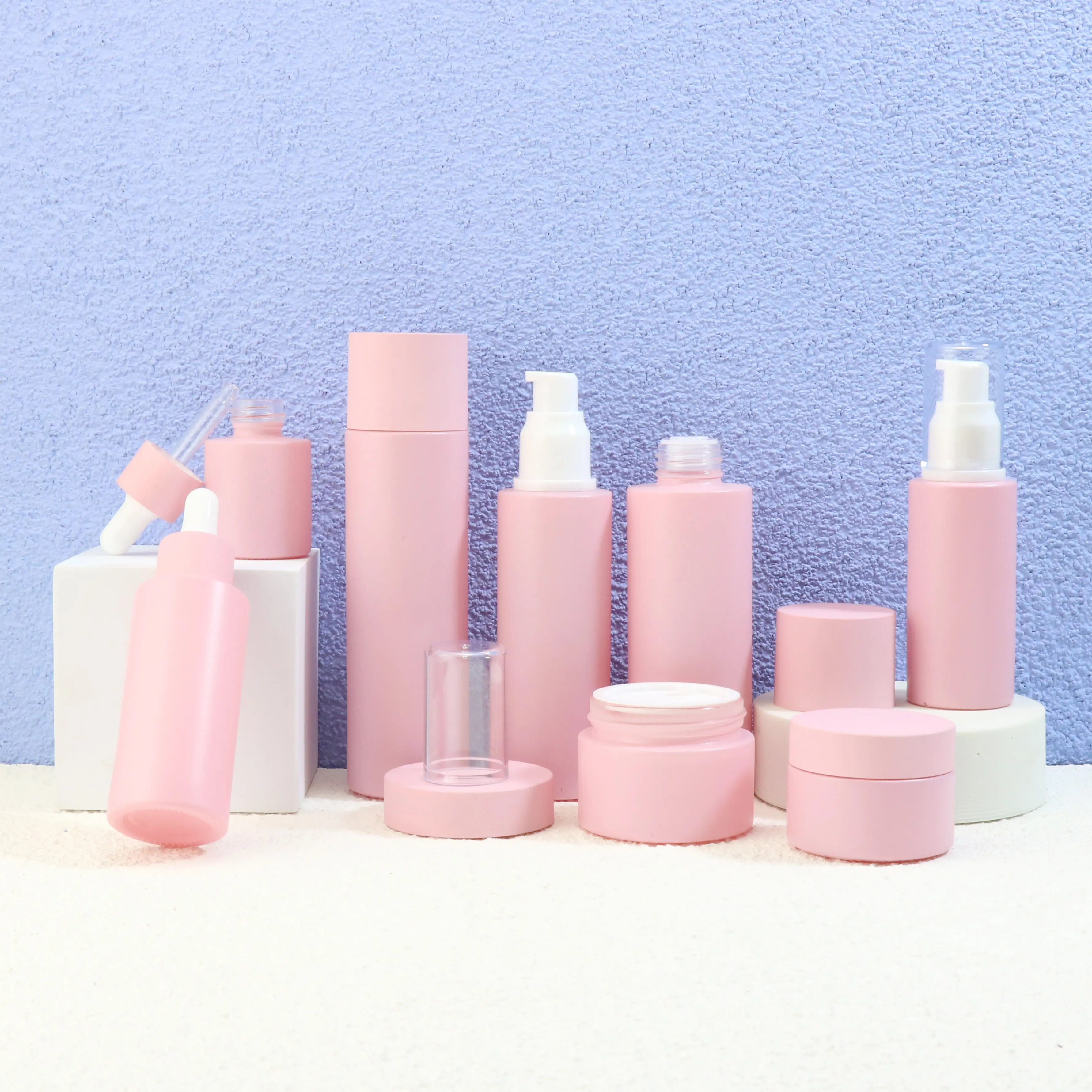 China Supplier 20ml 30ml 60ml 80ml pink Cosmetic packaging spray bottles set frosted skincare packaging glass bottle