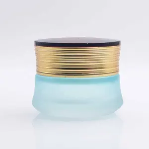 Luxury empty glass cosmetic jars blue transparent with gold lid 50g 100g face cream packaging bottle supplier