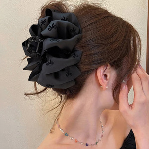 High-end black bubble <b>bow</b> hair <b>clip</b> for women with voluminous hair, perfect for updos. - Product Image 1