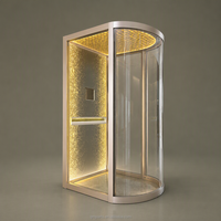 Cabine d'ascenseur améliorée avec plafond étoilé LED semi-circulaire à vue panoramique, sol en marbre poli et porte centrale à ouverture manuelle
