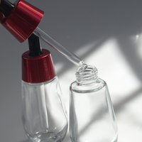 Flacon compte-gouttes en verre cylindrique pour huile essentielle cosmétique de luxe personnalisé 30 ml 50 ml avec bouchon rouge, flacon compte-gouttes en verre pour sérum cosmétique