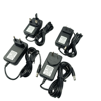 Assurance qualité 12V 1A Adaptateur secteur mural 50/60Hz Alimentation à découpage avec connexion enfichable Comprend un type de sortie CC et CA