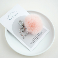 Une variété de porte-clés en forme de boule de lapin Rex populaires, pendentifs en peluche mignons, pendentifs de sac en forme de boule, nouveau style d'hiver