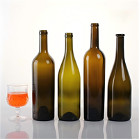 Botella de vino de vidrio de calidad superior de fábrica de China Botella de vino de color transparente en stock