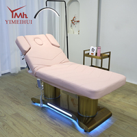 Table de massage électrique de luxe à 4 moteurs avec base dorée et éclairage LED pour salon de beauté