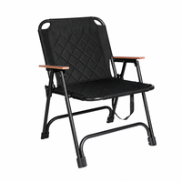 Chaise de camping noire durable avec structure en acier renforcé, tissu matelassé 600D, pliable à plat