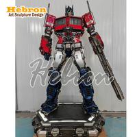Özelleştirilmiş Açık Hava Dev Optimus Prime 3D Transformer Robot Heykeli Transformer Gerçek Boyutlu Film Heykelleri Kahraman Heykeli