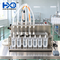 Machine de remplissage semi-automatique pour liquides, pour sachets Doypack de boissons lactées, avec rail de support pour sachets et commande par pédale, six têtes M6
