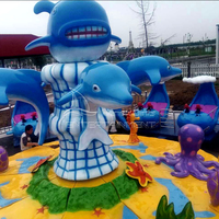 Manège aquatique rotatif pour enfants en plein air, avec fonction de pulvérisation d'eau, en forme de dauphin ou de requin, à vendre