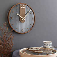 Nouvelle horloge murale en bois d'acacia de manguier de conception à la mode pour la décoration de maison de bureau et d'hôtel disponible à un prix abordable
