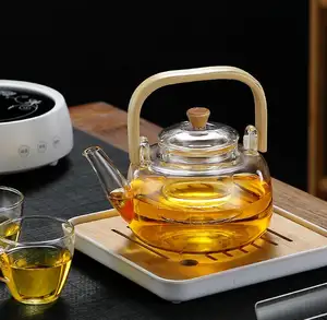 Teapot Custom Capacity Logo Printing High Borosilicate Clear Glass Tea Maker Teapot Cooker Stovetop Tea Pot with Bamboo Handle