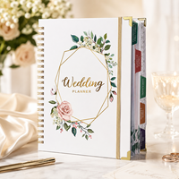 Carnet de planification de mariage OEM avec couverture blanche et motifs floraux, fabriqué par le fabricant