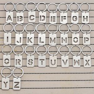 Porte-clés personnalisé en métal ajouré avec 26 lettres et pendentif plaqué chien brossé pour clés de voiture, cadeaux promotionnels - Product Image 1