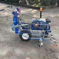 Machine de marquage routier à double pistolet pour peinture à froid, idéale pour les parkings, terrains de sport et les chantiers de construction