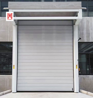 Portes d'entrepôt isolées résistantes aux ouragans pour le projet du parc logistique HX, porte spirale à grande vitesse, porte à enroulement industrielle