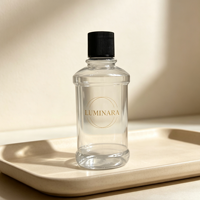 Bouteille diffuseur à roseaux en verre transparent avec bouchon à vis nervuré noir, logo LUMINARA doré en relief, conteneur de parfum vide de luxe