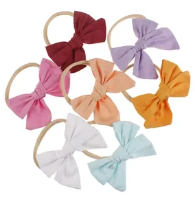 Manufacturer Wholesale Handmade Solid Color Pure Cotton Bow Children's Nylon Hair Band Baby Girl New Bouncy Hair With Band