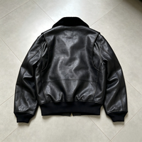 Blouson aviateur en cuir noir pour homme, sur mesure OEM, col en peau de mouton, boutons vintage, style rétro classique, vêtement de travail en cuir.