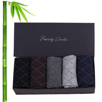 Vente en gros de chaussettes unies de luxe avec logo personnalisé Chaussettes lourdes tricotées décontractées antidérapantes pour les affaires Robe en bambou Couleurs blanches et noires