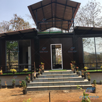 Maisons préfabriquées de luxe 20 pieds avec cuisine salle de bain maison conteneur d'expédition noire avec hôtel d'une chambre