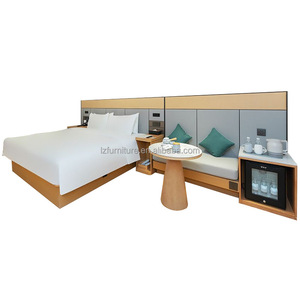 Ensemble de lit d'hôtel moderne en bois à prix abordable avec tête de lit rembourrée et canapé intégré pour hôtels commerciaux 3 étoiles - Product Image 1