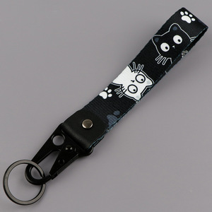 Correa de poliéster mate con estampado de pata de gato de dibujos animados en blanco y negro, clip de águila, llavero de gatito, regalo para amantes de los gatos - Product Image 1