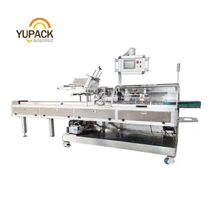 Continuous cartoning machine side loading for packing flow-wraps, pouches, bags, thermoformed trays, blisters, jars